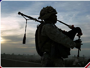 Marine plays bagpipes in Fallujah.jpg